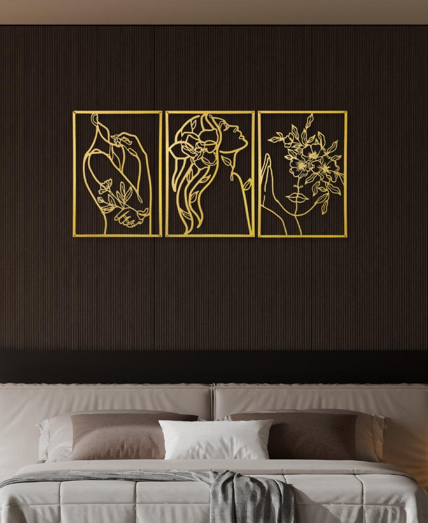 Gold custom metal line art mounted above a bed